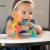 Grzechotko-gryzak z Przyssawką Niebieski — Fat Brain Toys