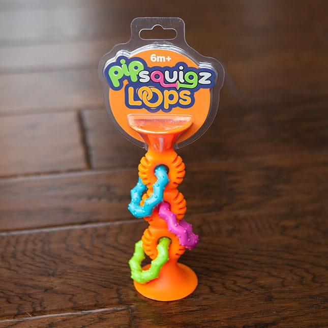 Grzechotko-gryzak z Przyssawką Pomarańczowy — Fat Brain Toys