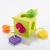 Sorter Kostka OombeeCube Fat Brain Toys – widok z kształtami w różnych kolorach: zielony, pomarańczowy, fioletowy i żółty, zabawka sensoryczna dla dzieci