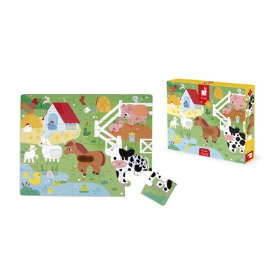 Ułożone puzzle dotykowe Farma Janod obok pudełka, z odłączonym elementem z krową