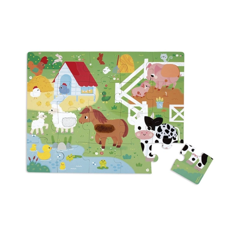 Puzzle dotykowe Janod Farma ułożone na białym tle z jednym elementem odłożonym obok