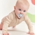 Smoczek pozycjonujący LUU Kids Baby Dove - przód tarczy z uchwytem z silikonowych kuleczek z dzieckiem